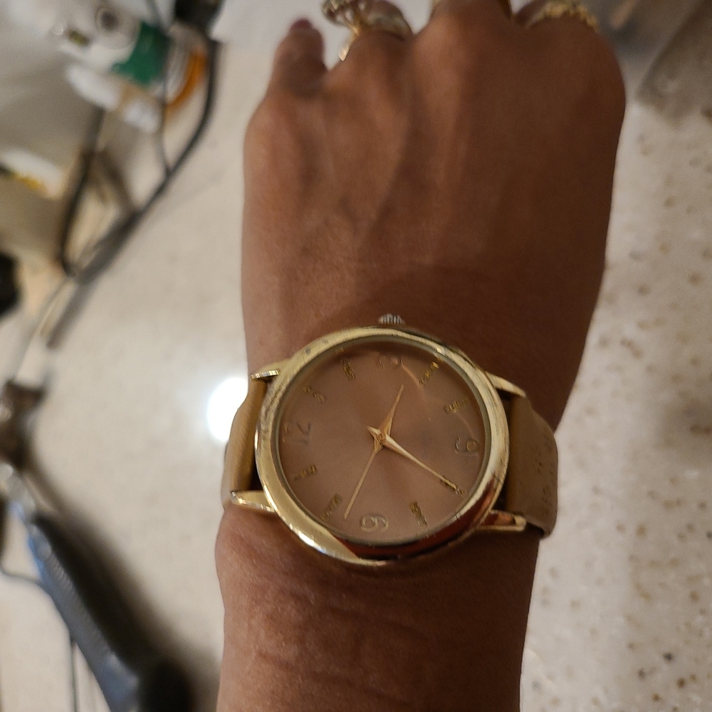 Tan Singapore MOVT women's watch.